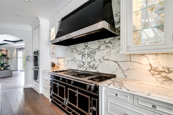 Interior, Kitchen, Marble Walls, Recessed Lighting, Stainless Steel Appliances, Wood Texture Flooring