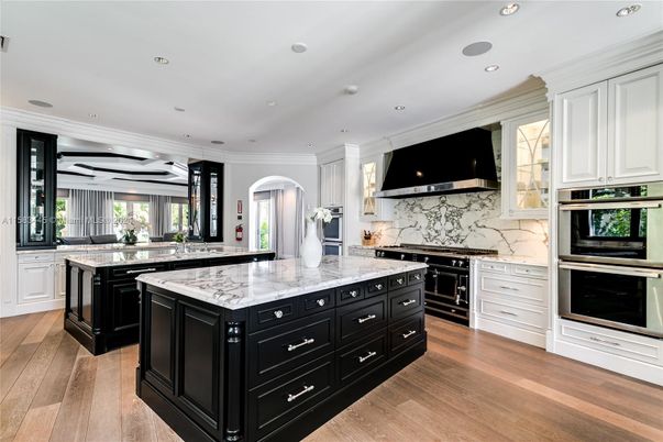 Interior, Kitchen, Marble Walls, Recessed Lighting, Stainless Steel Appliances, Wood Texture Flooring