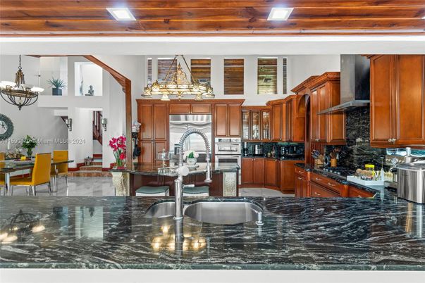 Chandelier, Dining room, Interior, Kitchen, Pendant Lights, Recessed Lighting, Stainless Steel Appliances, Wooden Ceilings