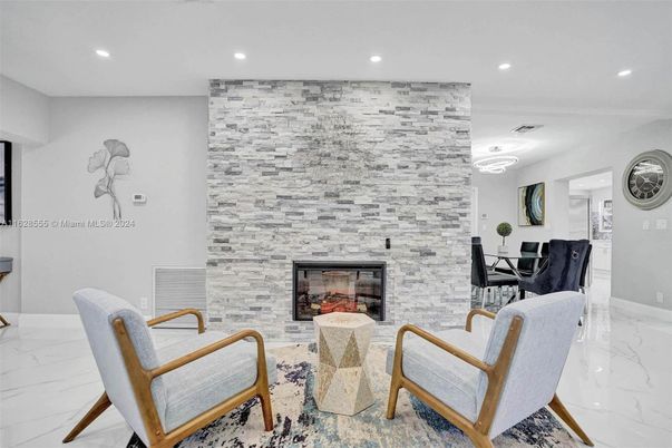 Fireplace, Interior, Living room, Marble, Recessed Lighting, Stone Walls