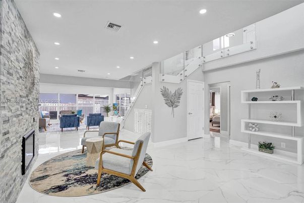 Fireplace, Interior, Living room, Marble, Recessed Lighting, Stone Walls