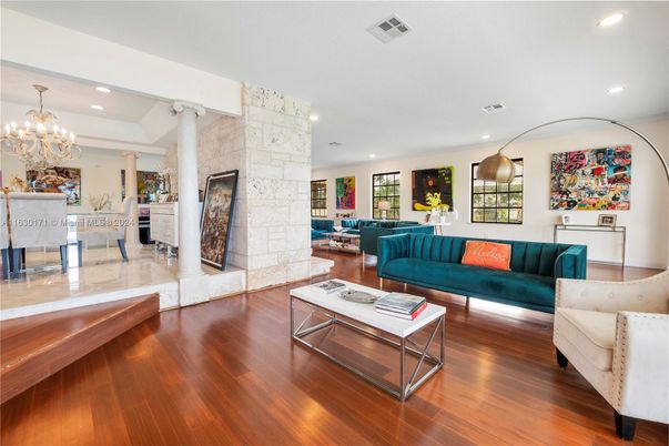 Chandelier, Dining room, Fireplace, Interior, Living room, Recessed Lighting, Stone Walls, Wood Texture Flooring