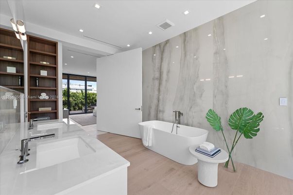 Bathroom, Free Standing Baths, Interior, Marble Walls, Recessed Lighting, Wood Texture Flooring