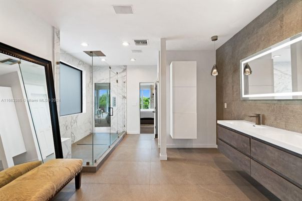 Bathroom, Dual Sink Vanities, Glass Shower, Interior, Marble Walls, Recessed Lighting