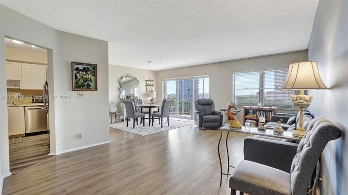 Chandelier, Dining room, Interior, Kitchen, Living room, Pendant Lights, Recessed Lighting, Stainless Steel Appliances, Wood Texture Flooring