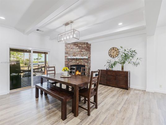 Dining room, Fireplace, Interior, Pendant Lights, Recessed Lighting, Stone Walls, Wood Texture Flooring