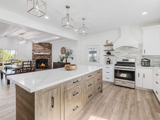 Dining room, Fireplace, Interior, Kitchen, Pendant Lights, Recessed Lighting, Stainless Steel Appliances, Stone Walls, Wood Texture Flooring