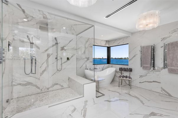 Bathroom, Free Standing Baths, Glass Shower, Interior, Marble, Marble Walls, Recessed Lighting