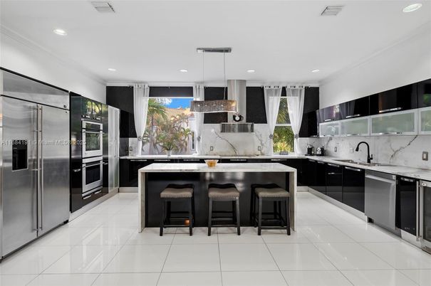 Interior, Kitchen, Marble Walls, Pendant Lights, Recessed Lighting, Stainless Steel Appliances
