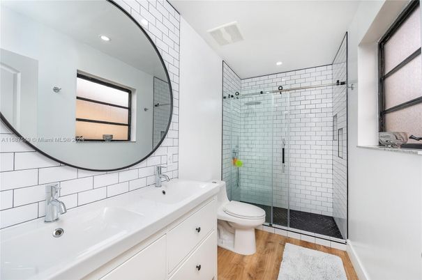 Bathroom, Dual Sink Vanities, Glass Shower, Interior, Recessed Lighting, Wood Texture Flooring