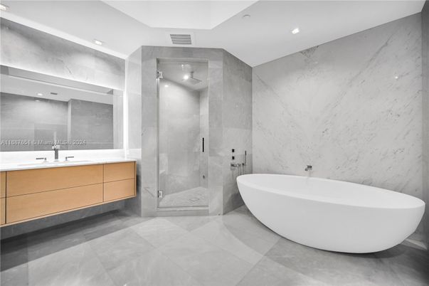 Bathroom, Dual Sink Vanities, Free Standing Baths, Glass Shower, Interior, Marble Walls, Recessed Lighting