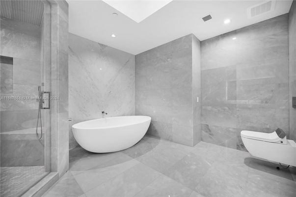 Bathroom, Free Standing Baths, Glass Shower, Interior, Marble Walls, Recessed Lighting