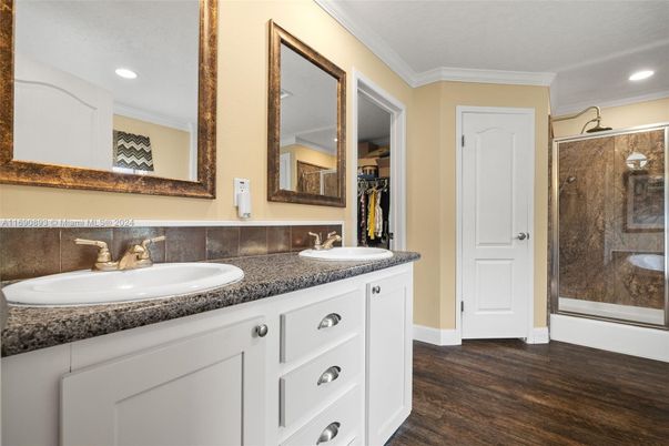 Bathroom, Dual Sink Vanities, Glass Shower, Interior, Recessed Lighting, Wood Texture Flooring
