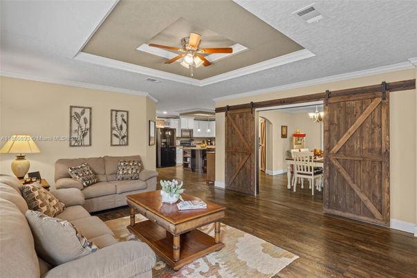 Chandelier, Dining room, Interior, Kitchen, Living room, Stainless Steel Appliances, Wood Texture Flooring