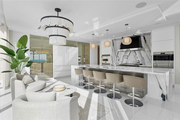Interior, Kitchen, Marble Walls, Pendant Lights, Recessed Lighting, Stainless Steel Appliances