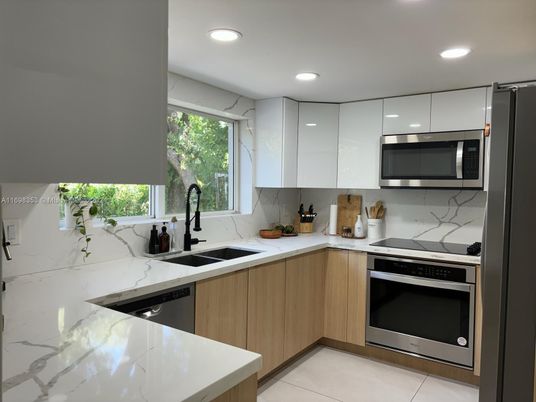 Interior, Kitchen, Marble Walls, Recessed Lighting, Stainless Steel Appliances