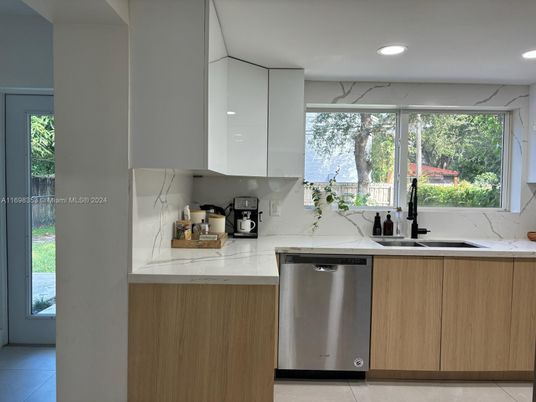 Interior, Kitchen, Marble Walls, Recessed Lighting, Stainless Steel Appliances