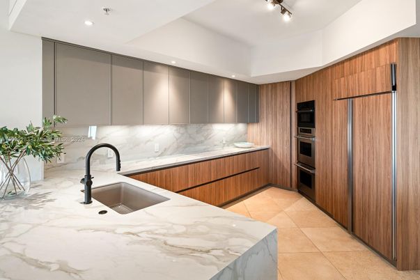 Interior, Kitchen, Marble Walls, Recessed Lighting, Stainless Steel Appliances