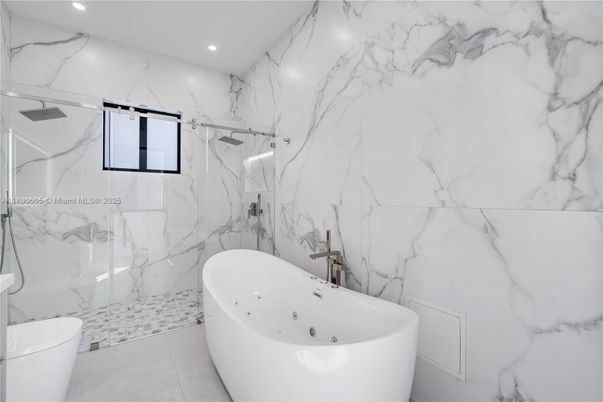 Bathroom, Free Standing Baths, Glass Shower, Interior, Marble Walls, Recessed Lighting