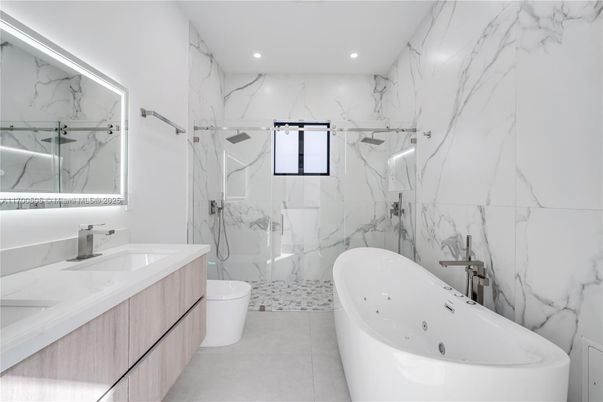 Bathroom, Dual Sink Vanities, Free Standing Baths, Glass Shower, Interior, Marble Walls, Recessed Lighting