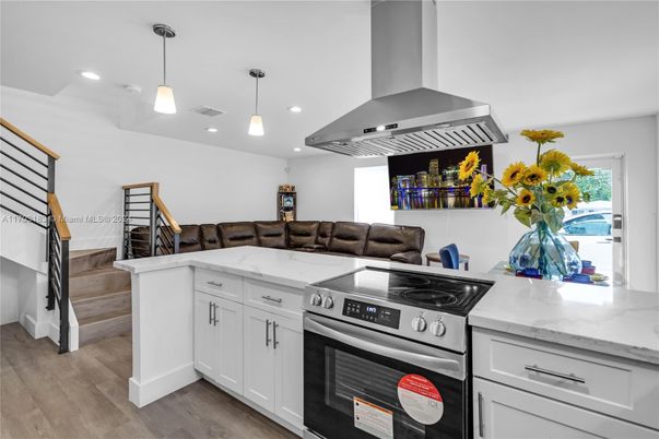 Interior, Kitchen, Pendant Lights, Recessed Lighting, Stainless Steel Appliances, Wood Texture Flooring