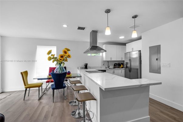 Dining room, Interior, Kitchen, Pendant Lights, Recessed Lighting, Stainless Steel Appliances, Wood Texture Flooring