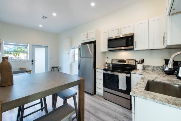 Interior, Kitchen, Recessed Lighting, Stainless Steel Appliances, Wood Texture Flooring
