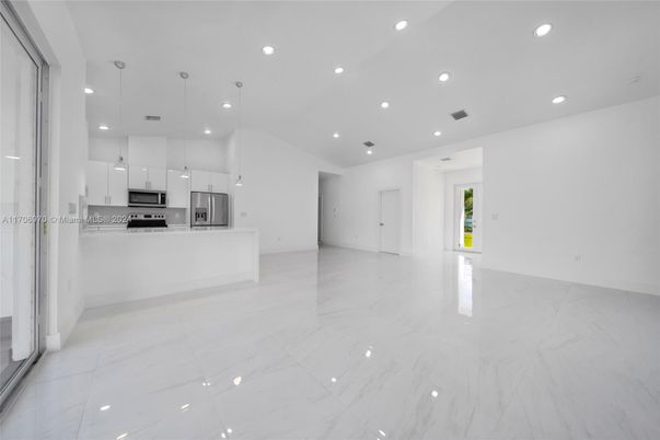 Empty room, Interior, Kitchen, Marble, Pendant Lights, Recessed Lighting, Stainless Steel Appliances
