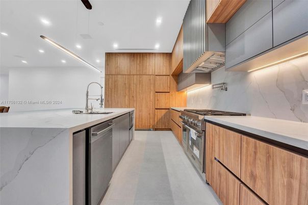 Interior, Kitchen, Marble Walls, Recessed Lighting, Stainless Steel Appliances
