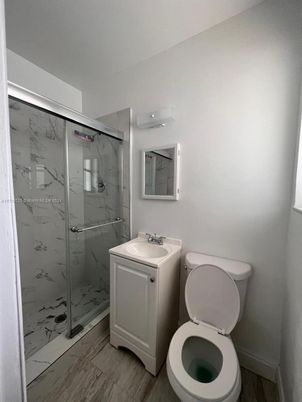 Bathroom, Glass Shower, Interior, Marble Walls, Wood Texture Flooring
