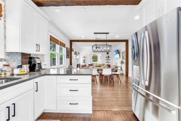 Dining room, Interior, Kitchen, Pendant Lights, Recessed Lighting, Stainless Steel Appliances, Wood Texture Flooring