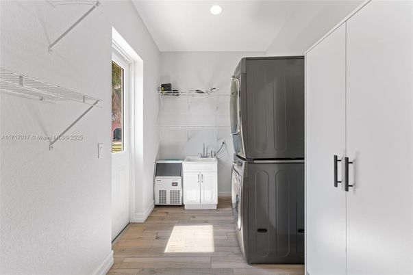 Interior, Kitchen, Recessed Lighting, Utility Closets, Washer, Wood Texture Flooring