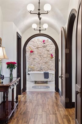 Bathroom, Chandelier, Free Standing Baths, Interior, Stone Walls, Wood Texture Flooring