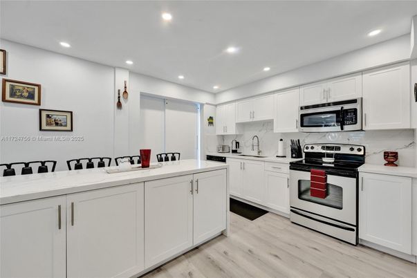 Interior, Kitchen, Recessed Lighting, Stainless Steel Appliances, Wood Texture Flooring