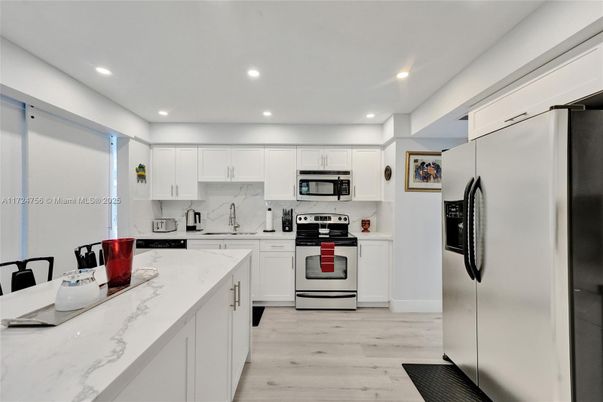 Interior, Kitchen, Recessed Lighting, Stainless Steel Appliances, Wood Texture Flooring