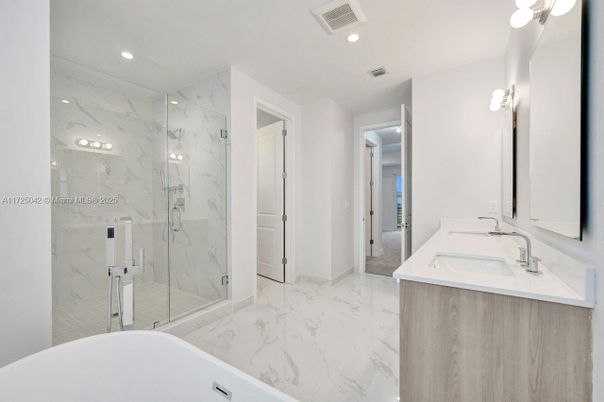 Bathroom, Dual Sink Vanities, Glass Shower, Interior, Marble, Marble Walls, Recessed Lighting