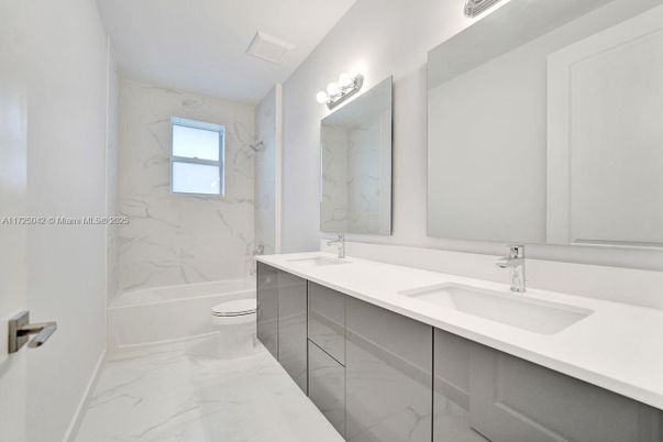 Bathroom, Dual Sink Vanities, Glass Shower, Interior, Marble, Marble Walls