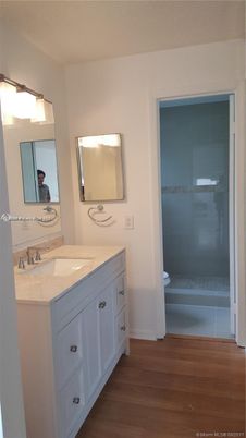 Bathroom, Dual Sink Vanities, Glass Shower, Interior, Wood Texture Flooring