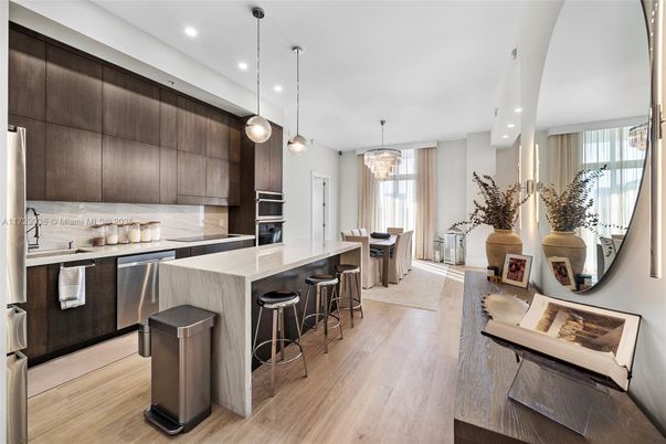 Chandelier, Dining room, Interior, Kitchen, Pendant Lights, Recessed Lighting, Stainless Steel Appliances, Wood Texture Flooring