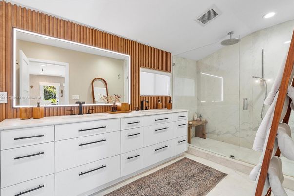 Bathroom, Dual Sink Vanities, Glass Shower, Interior, Marble Walls, Recessed Lighting