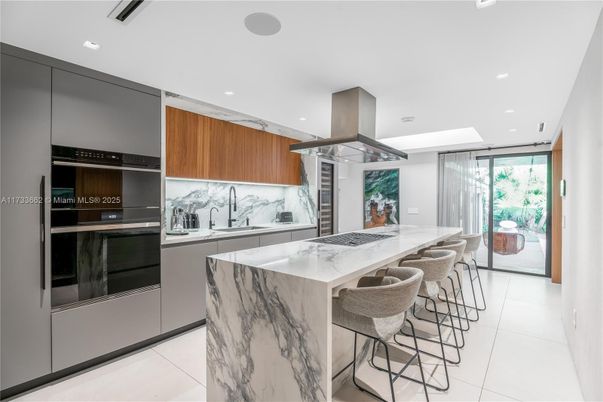 Interior, Kitchen, Marble Walls, Recessed Lighting, Stainless Steel Appliances