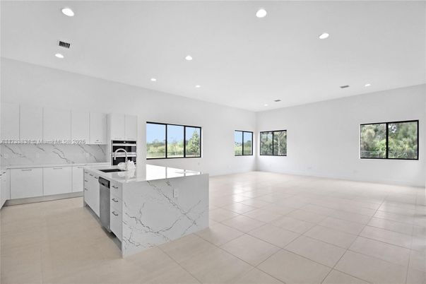 Interior, Kitchen, Marble Walls, Recessed Lighting, Stainless Steel Appliances