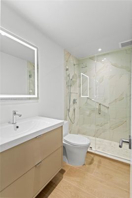 Bathroom, Glass Shower, Interior, Marble Walls, Recessed Lighting, Wood Texture Flooring