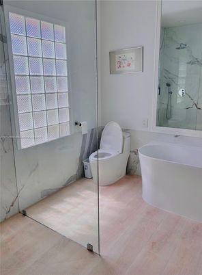 Bathroom, Free Standing Baths, Glass Shower, Interior, Marble Walls, Wood Texture Flooring