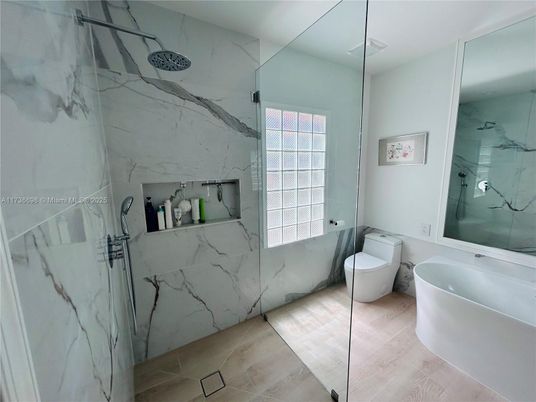 Bathroom, Free Standing Baths, Glass Shower, Interior, Marble Walls, Wood Texture Flooring