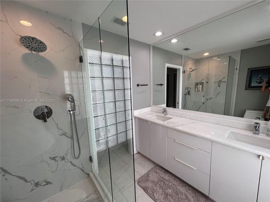 Bathroom, Dual Sink Vanities, Glass Shower, Interior, Marble, Marble Walls, Recessed Lighting