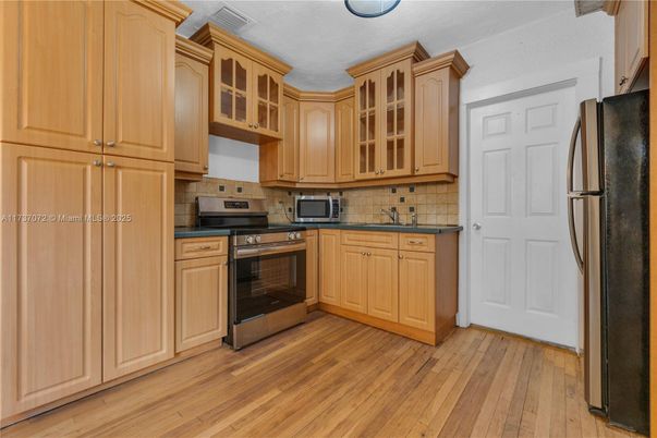 Interior, Kitchen, Tile Countertops, Wood Texture Flooring