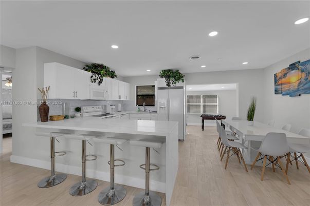 Dining room, Interior, Kitchen, Recessed Lighting, Stainless Steel Appliances, Wood Texture Flooring