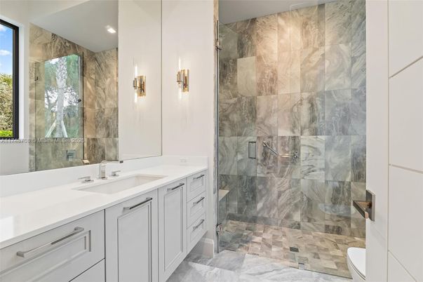 Bathroom, Dual Sink Vanities, Glass Shower, Interior, Marble, Marble Walls, Recessed Lighting
