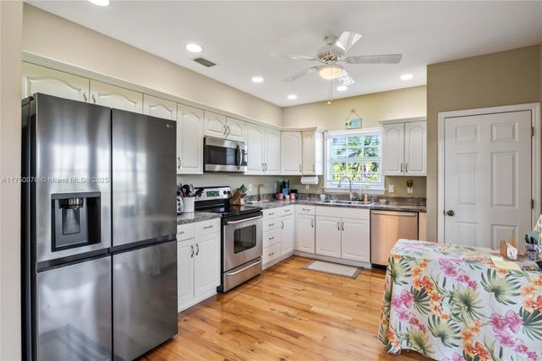Interior, Kitchen, Recessed Lighting, Stainless Steel Appliances, Wood Texture Flooring